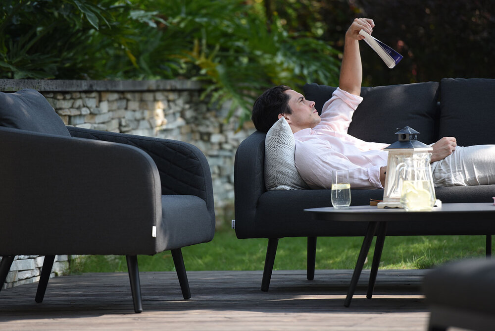 man lying down on cleaned fabric outdoor lounge set